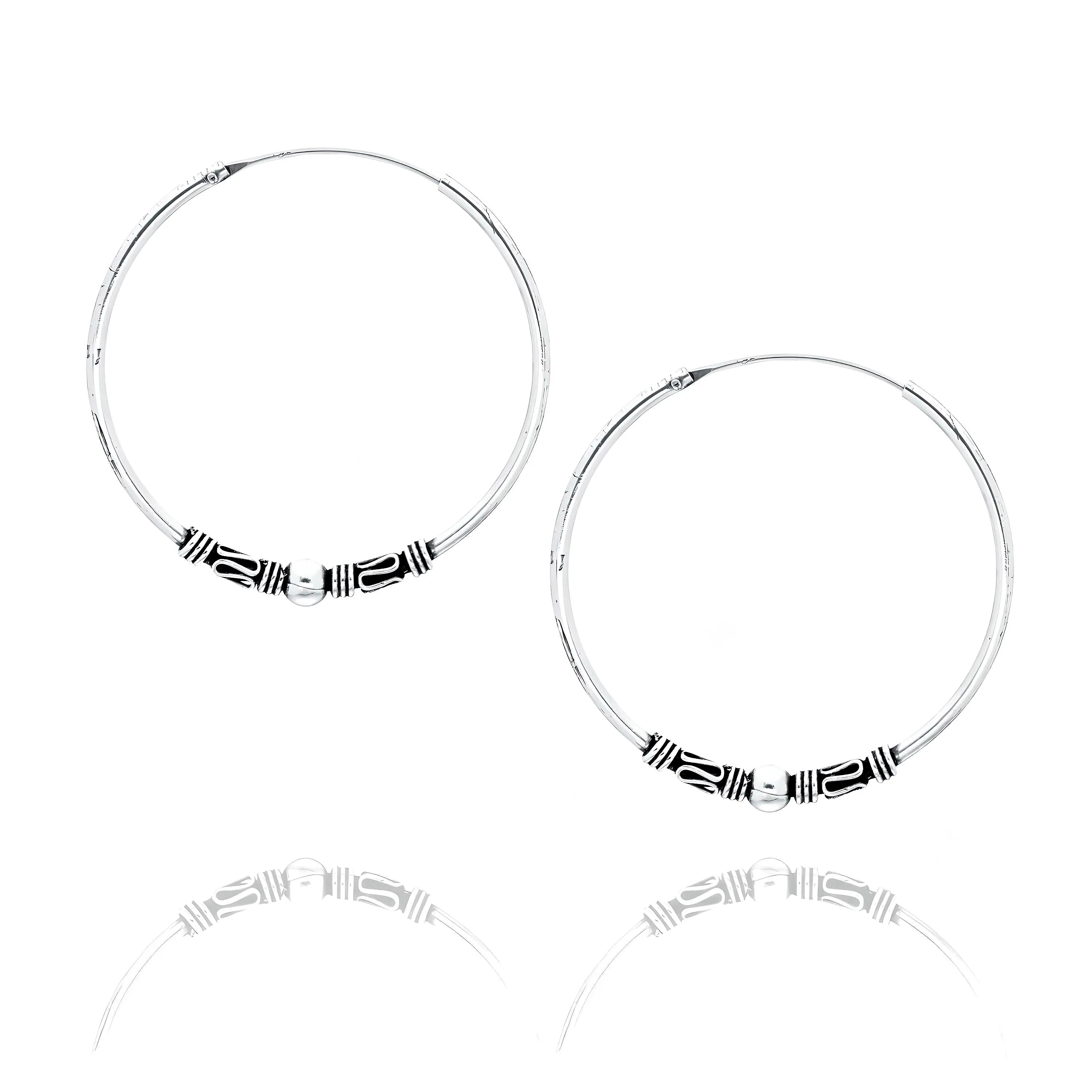 Tribal shape silver hoop earrings